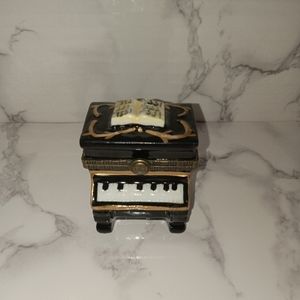 Piano with song book and gold tone accents trinket box